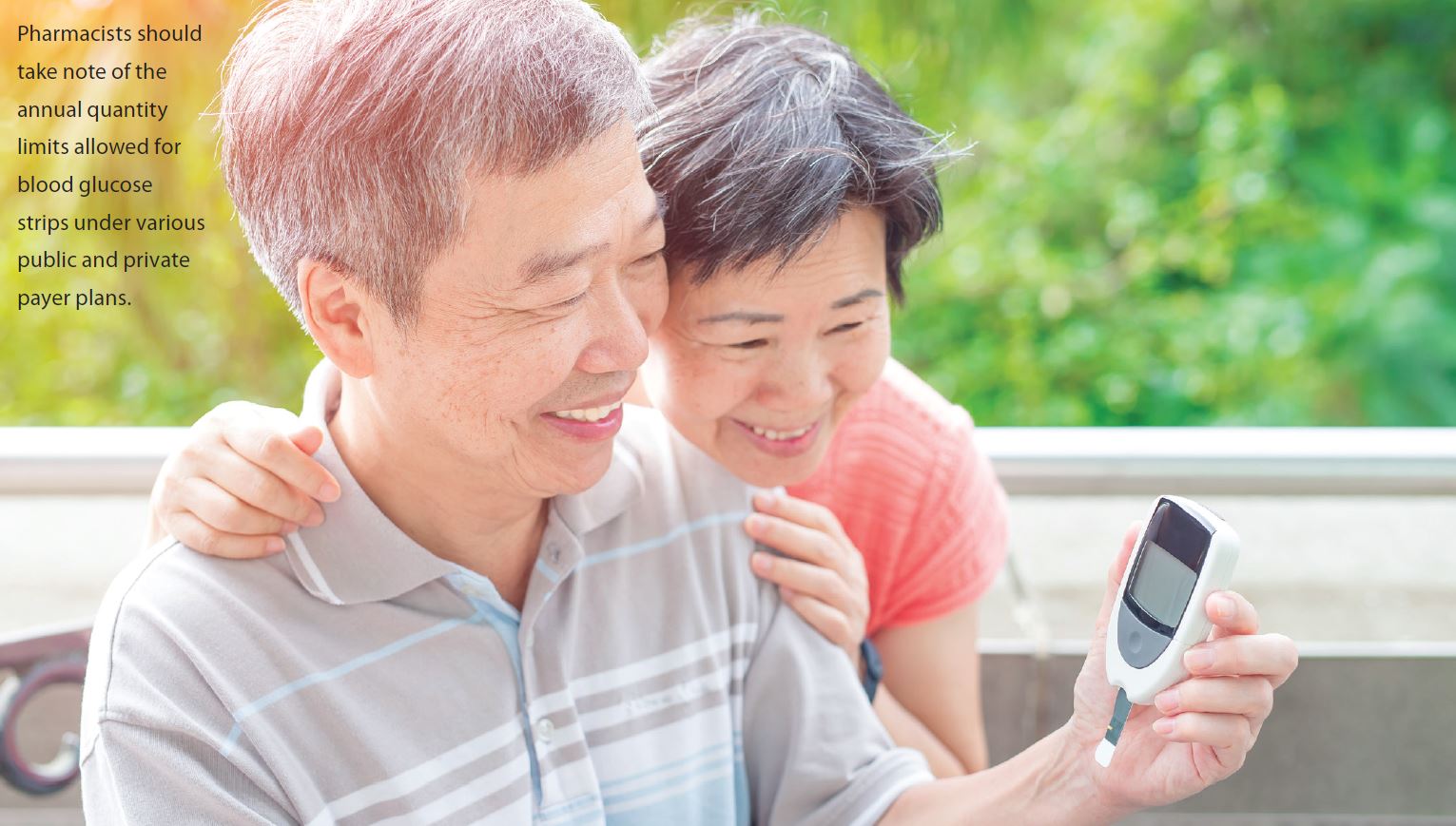 Couple looking at blood glucose monitor