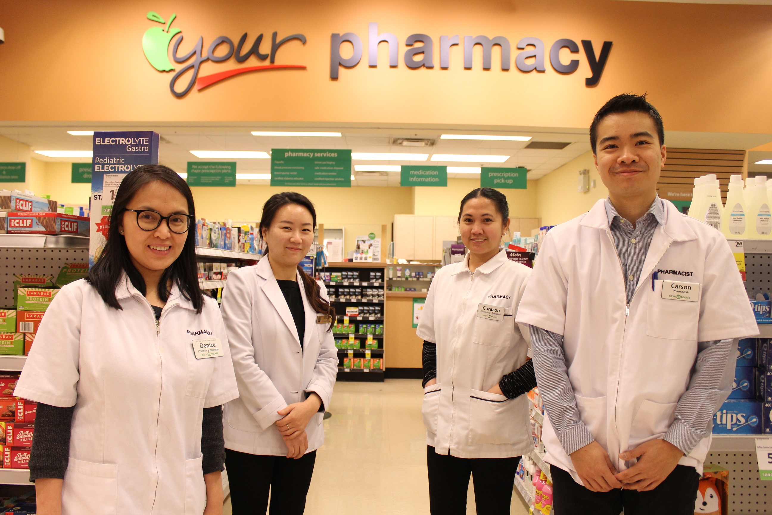 From left to right, pharmacy team members Denice, Eun Jin, Cora, Carson