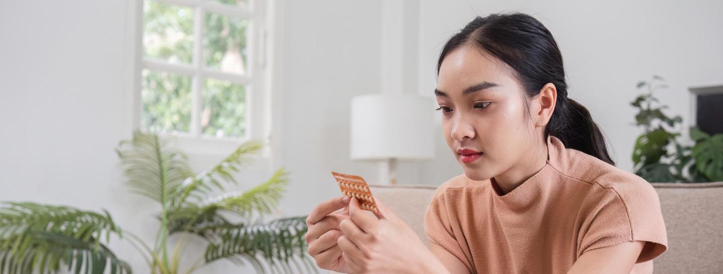 Young woman with oral contraceptives